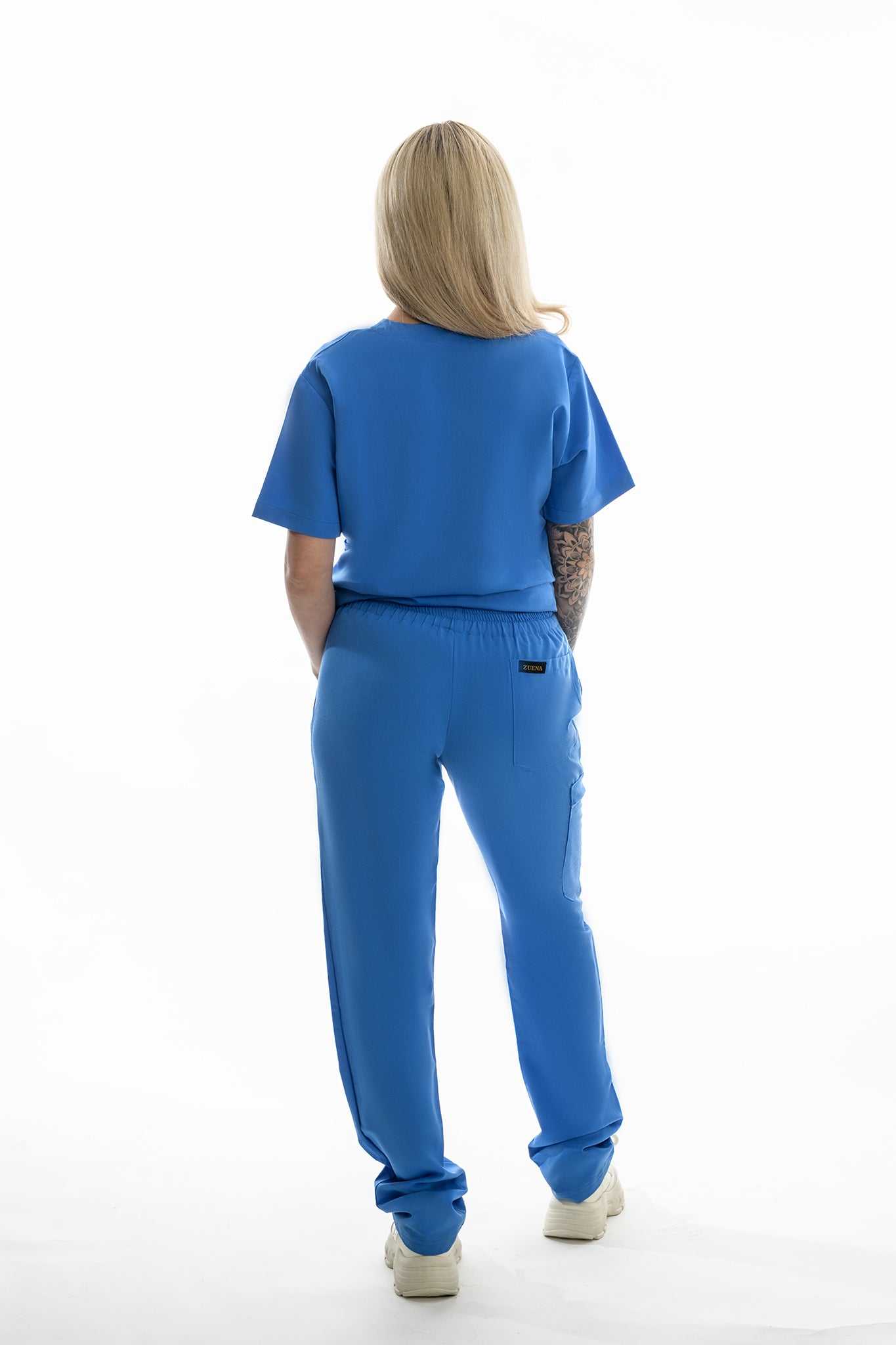 Person wearing a blue outfit on a white background