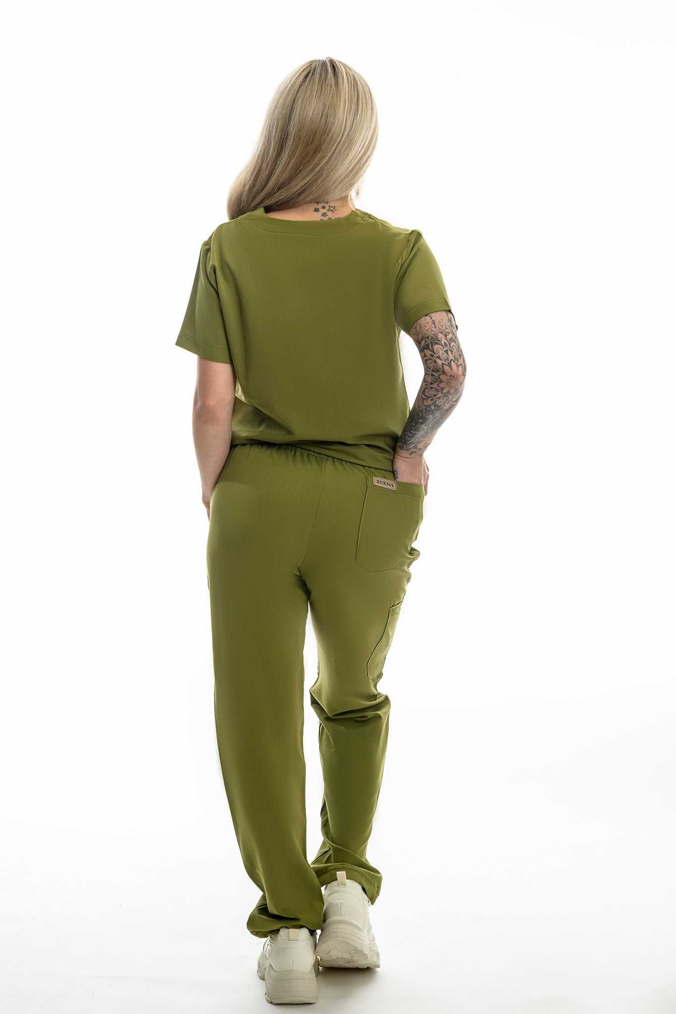 Back view of person wearing olive green Zuena Olive Grove scrub pants and matching top with elastic waistband and multiple pockets
