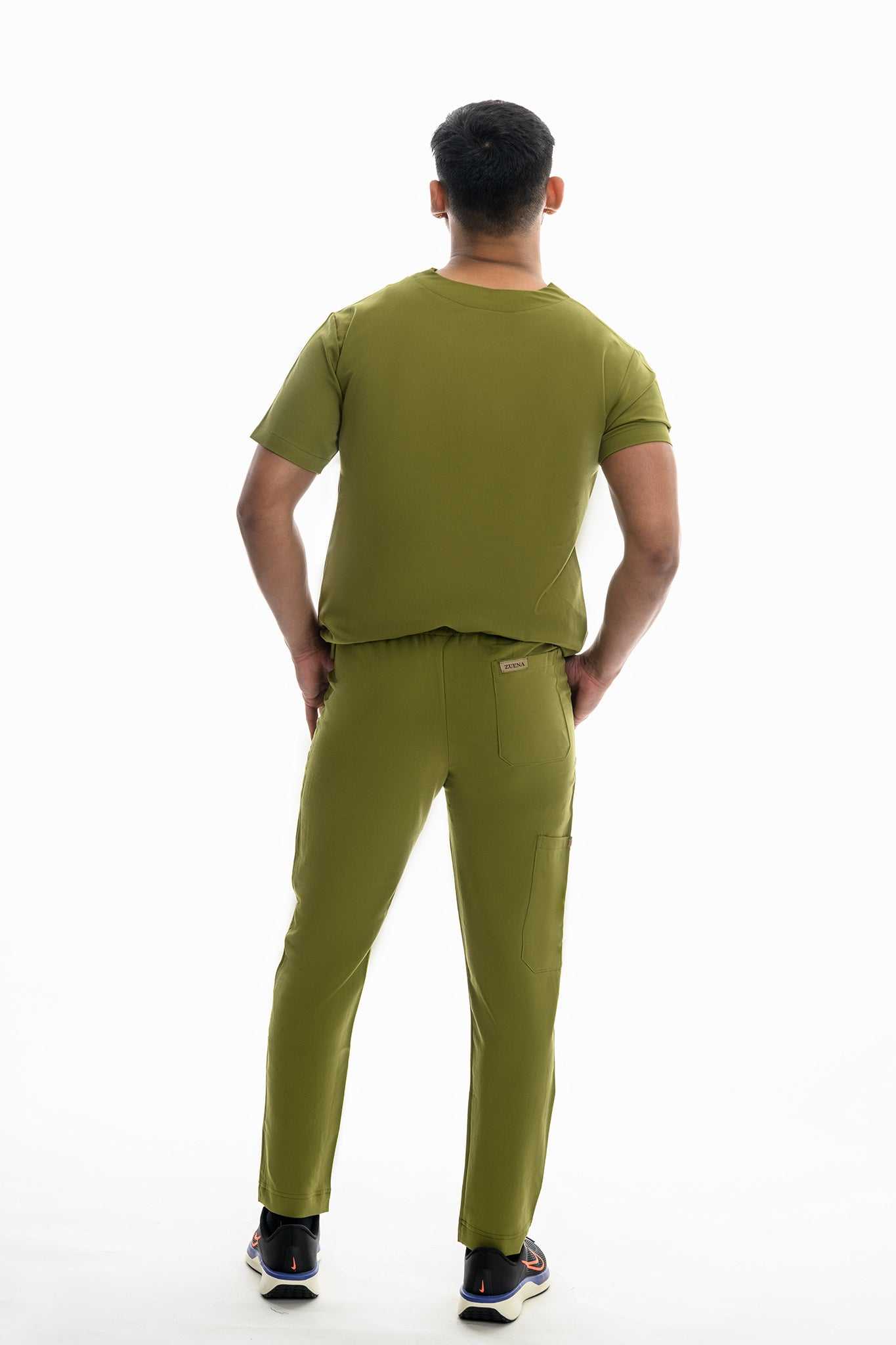 Man wearing Zuena Olive Scrub Set for men with elastic waist scrub pants and short sleeve top, rear view