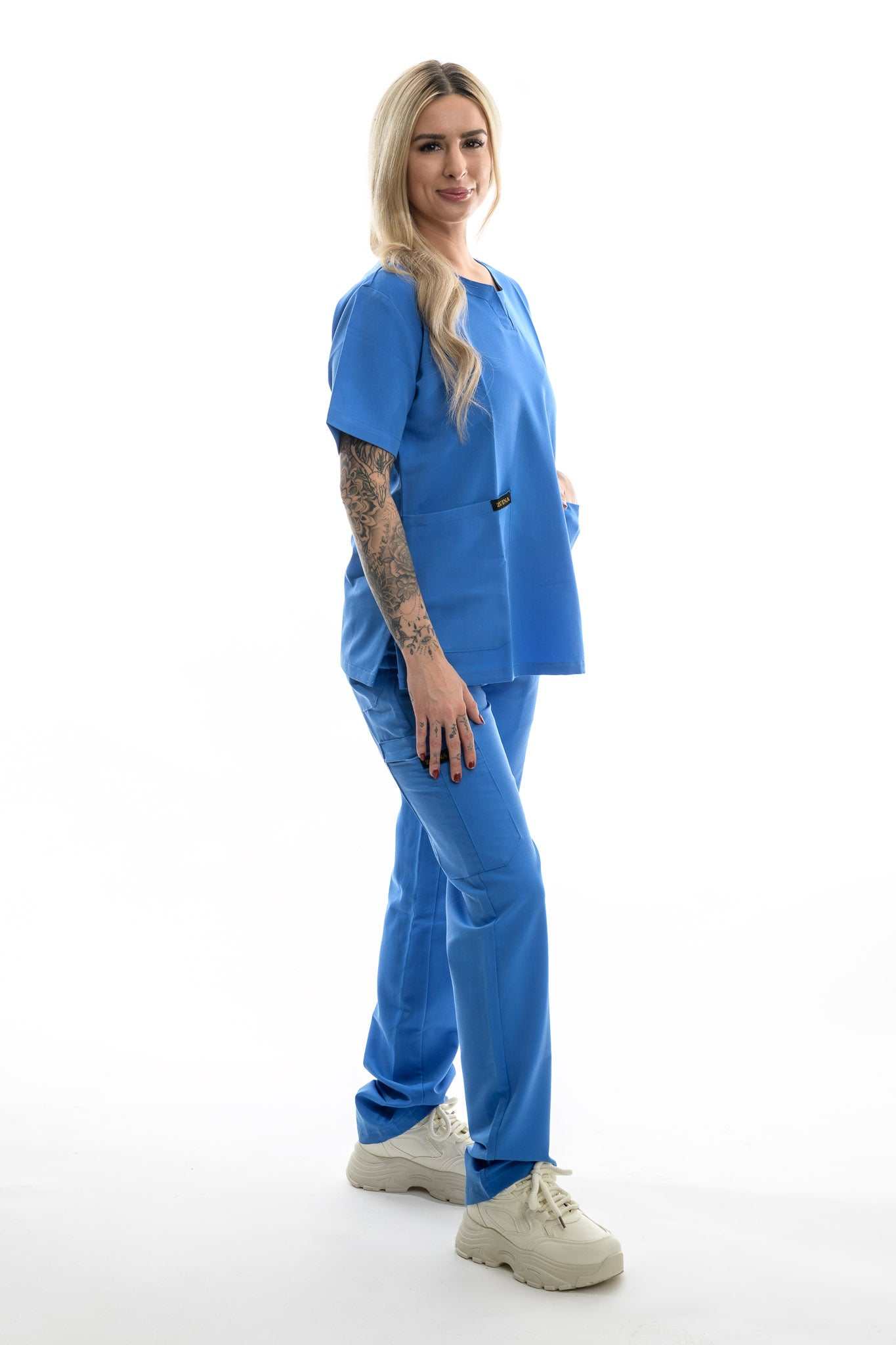 professional scrubs Skyward Bound Scrubs Set in blue worn by model showcasing comfort and flexibility